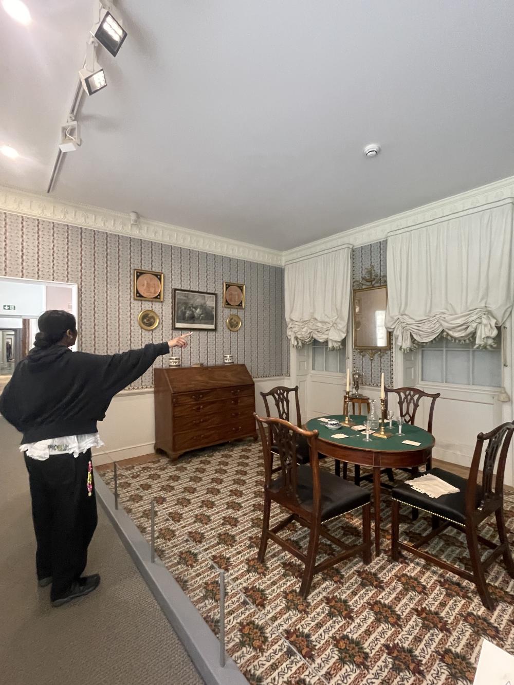 an old parlour recreated with details including a mop bucket showing the cleaner has been busy preparing the house for the middle class family