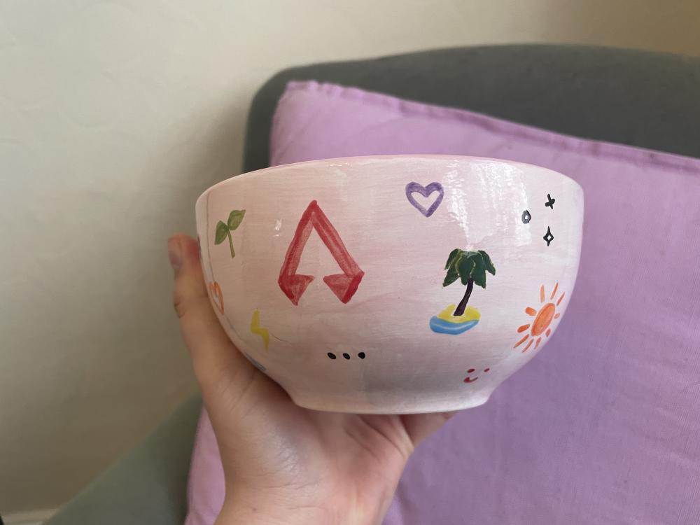 more symbols are dotted around the bowl including a palm tree, purple heart, elipsis, lightning bolt, sapling, sun, and the apex logo