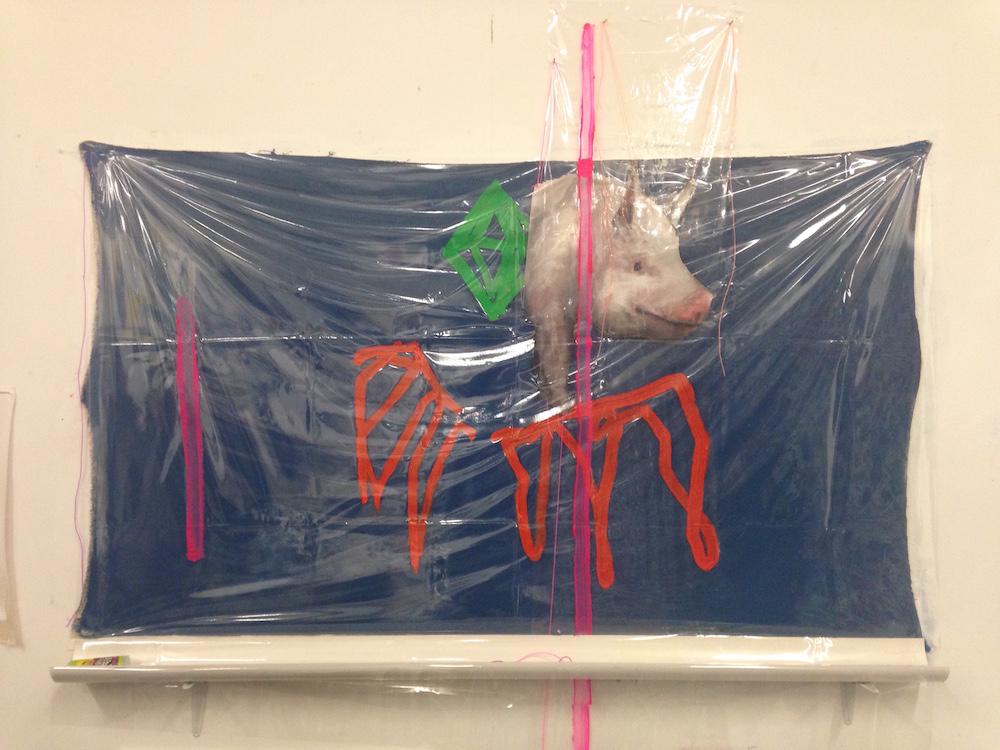 a blue piece of fabric is stretched on a wall, with a cut out painting of a pig over the top of it, and next to the pig is a sims green diamond painted in thick outlines, and there's also orange wings below, and then over top of these is a stretched bit of plastic, with two neon pink lines going down, and at the bottom of the painting collage thing there's a half white pipe that would collect any liquid poured over the plastic