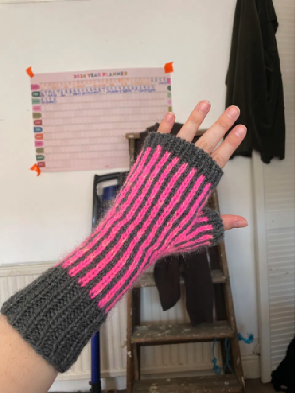pink and grey vertically-striped fingerless mittens