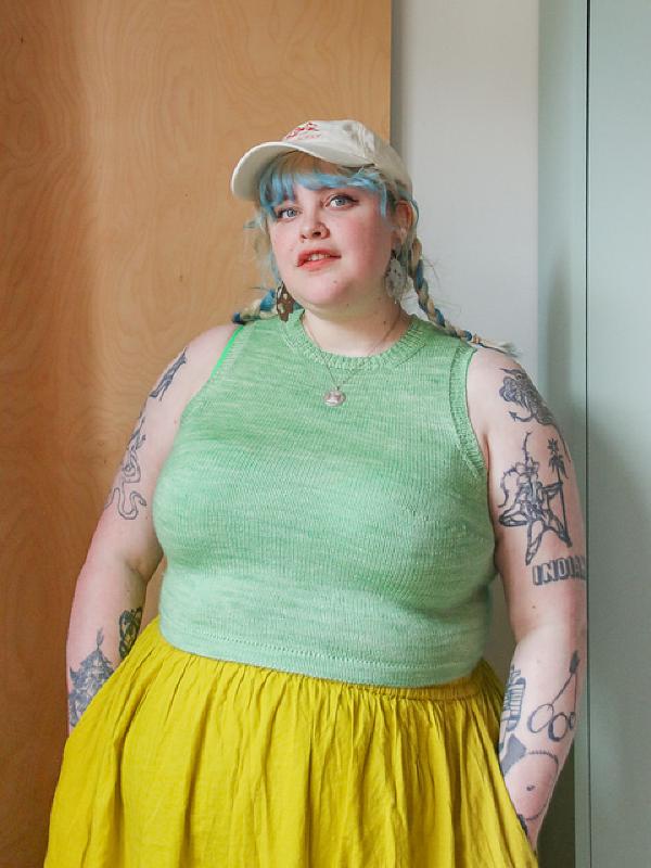 lydia wears a knitted tank top with no hole in the chest in one plain colour