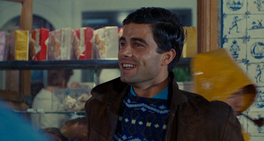 a smiling nino castelnuovo at the beginning of the film