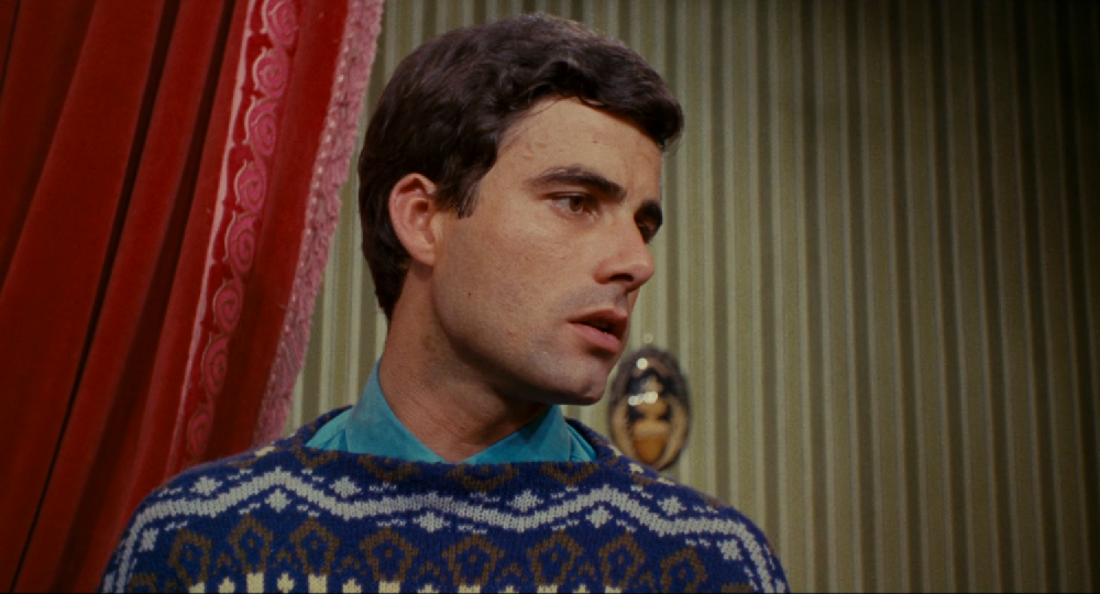 a concerned looking nino in a boatneck jumper