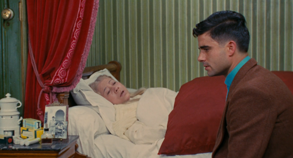 side shot of nino with a sharp fade, bedside to his sick aunt