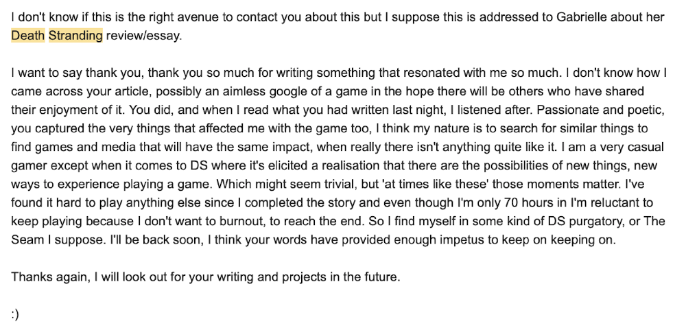 two people on a bridge look up at a huge scary grinning figure which has a bandaged face and one green eye visible