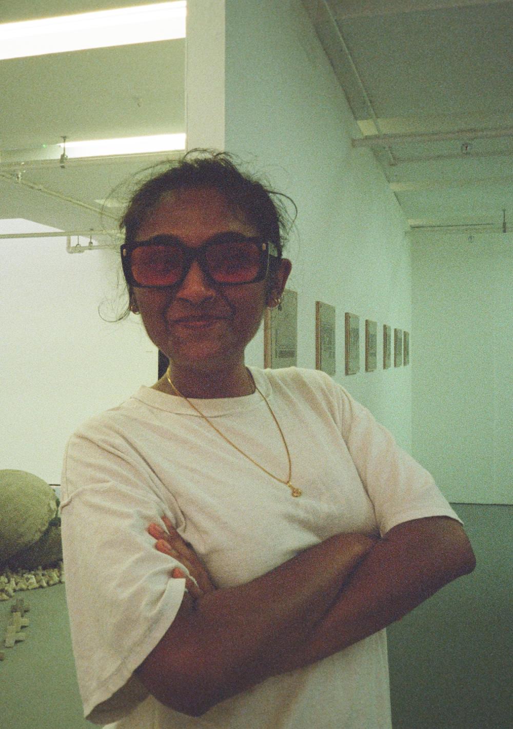 zarina posing with her arms crossed at the slade degree show