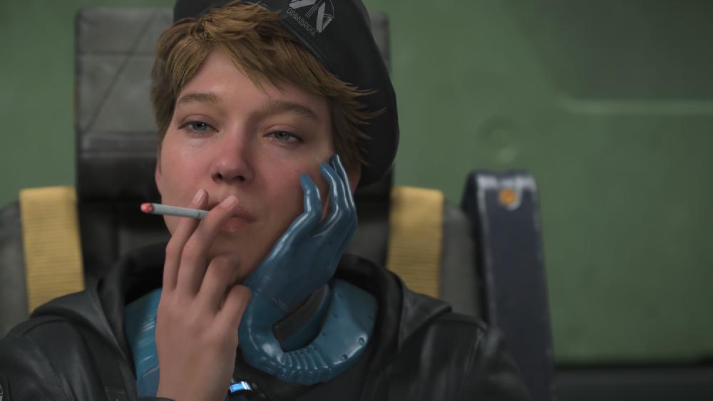 the puppet dollman puts a thumbs up and a blue heart appears about his hand