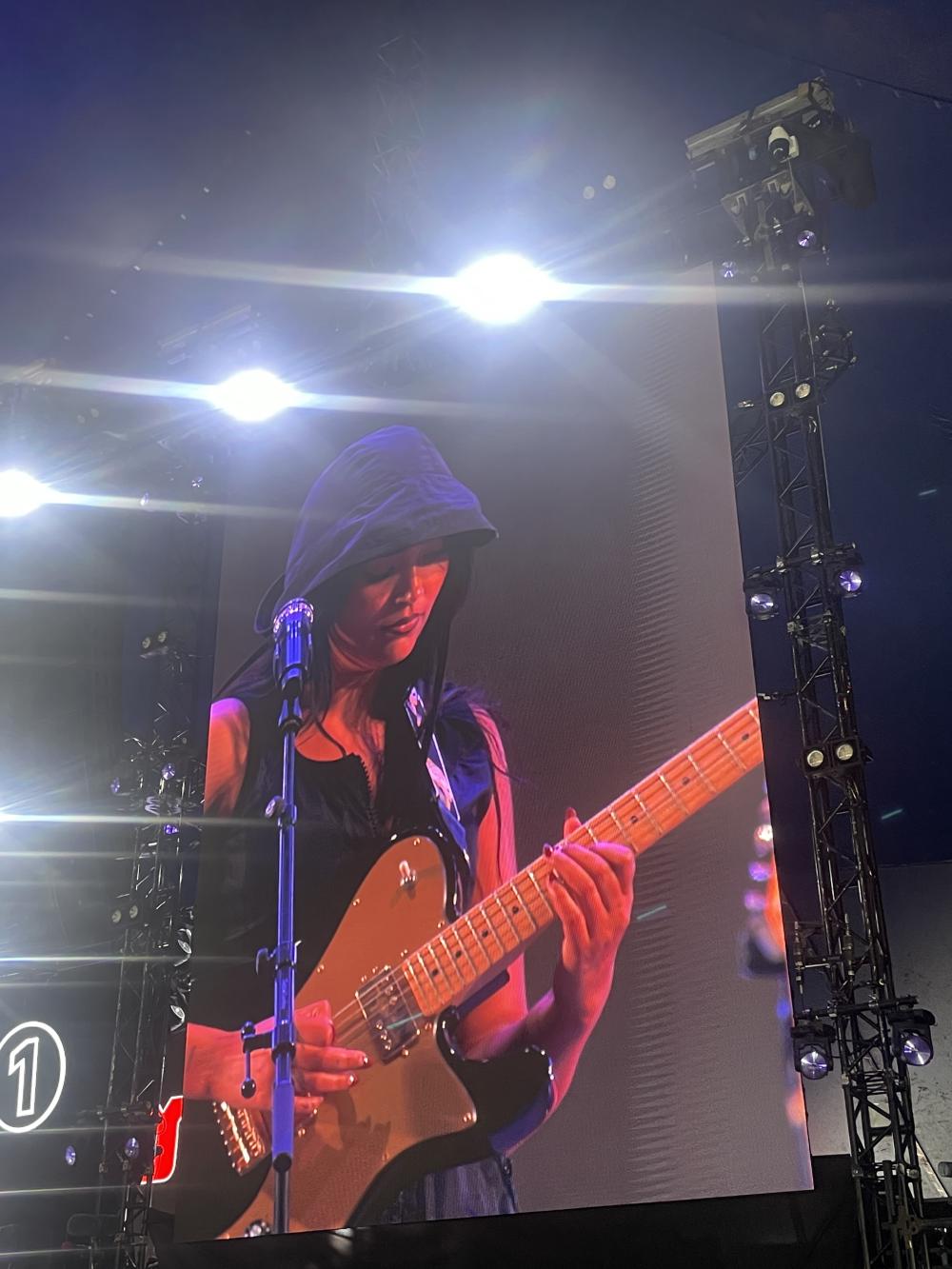 Joy Crookes on guitar