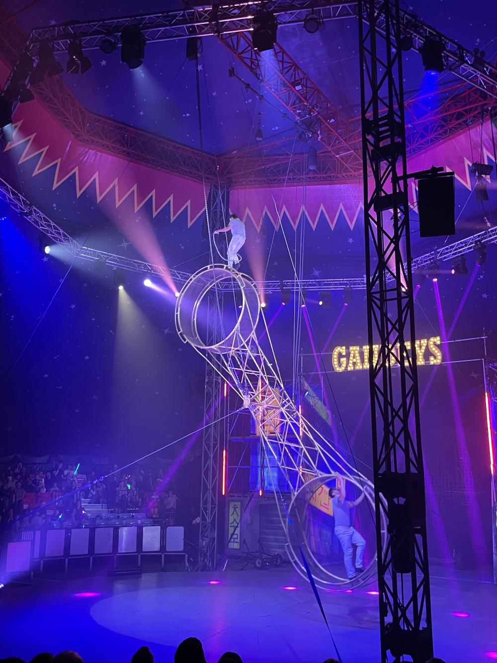 the wheel of death with a man on top mid jump rope