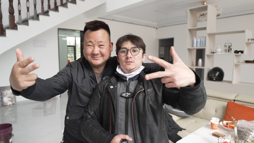 li and michael reeves posing for a picture in his house