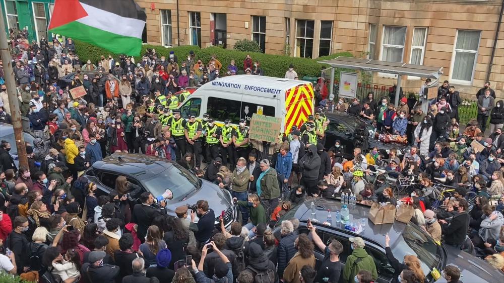 protesters surround an immigration van on kenmure street in glasgow